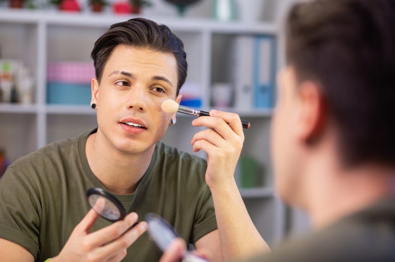 Man using make up brush