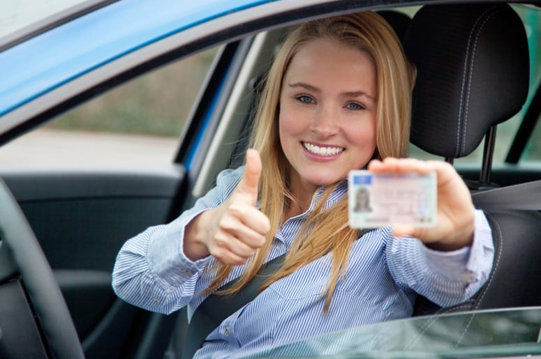 Woman Showing Her Driver's License