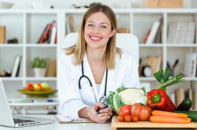 woman doctor sitting with her hands folded