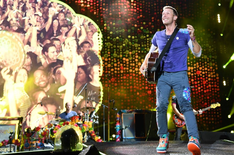 Chris Martin of Coldplay performs at the Hard Rock Stadium. Chris Martin of Coldplay performs at the Hard Rock Stadium.
