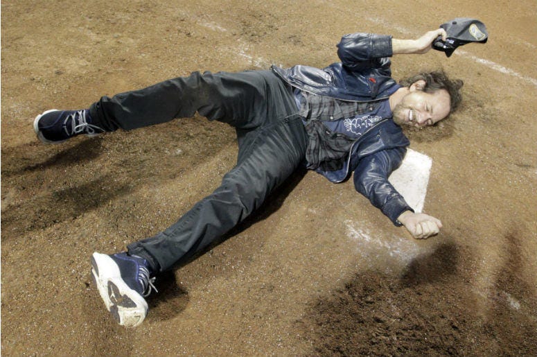 Recording artist Eddie Vedder celebrates on home plate after the Chicago Cubs defeated the Cleveland Indians in game seven of the 2016 World Series at Progressive Field Recording artist Eddie Vedder celebrates on home plate after the Chicago Cubs defeated the Cleveland Indians in game seven of the 2016 World Series at Progressive Field