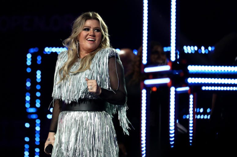 Kelly Clarkson performs during the opening night ceremony at Arthur Ashe Stadium Kelly Clarkson performs during the opening night ceremony at Arthur Ashe Stadium