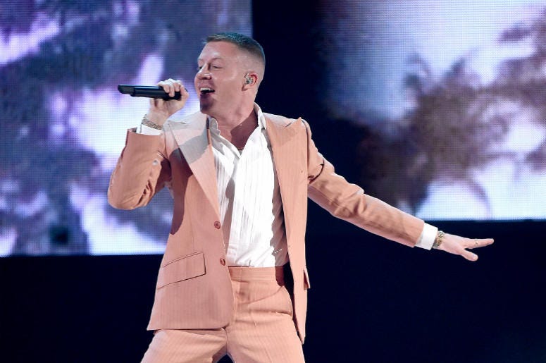 Macklemore LOS ANGELES, CA - NOVEMBER 19: Macklemore performs at the 2017 American Music Awards at Microsoft Theater on November 19, 2017 in Los Angeles, California.