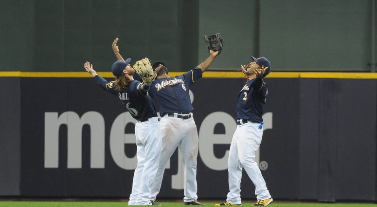 Brewers celebrate a win against the Pirates