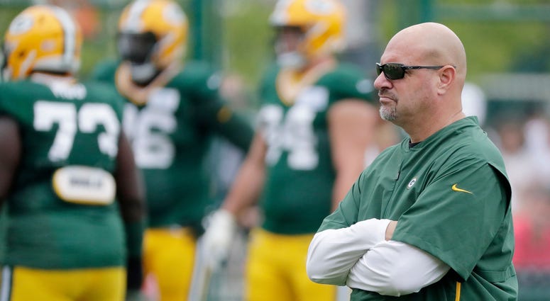 Mike Pettine looks on at the Packers defense