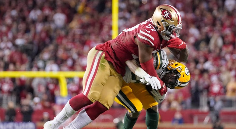 Aaron Jones gets swarmed under