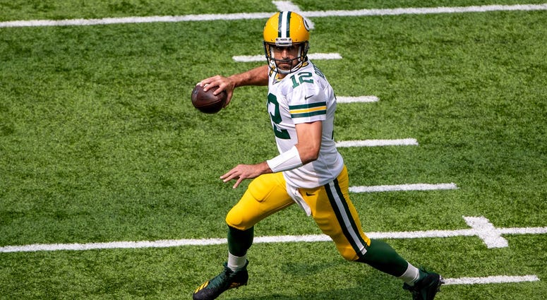 Aaron Rodgers rolls out