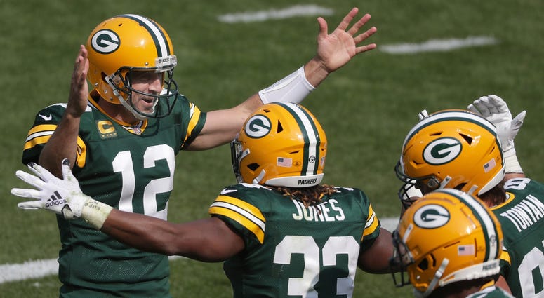 Rodgers and Jones celebrate in Packers win over Detroit