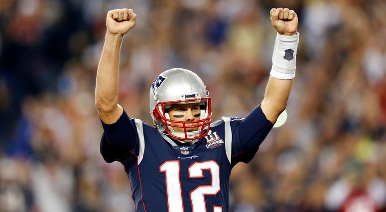 New England Patriots quarterback Tom Brady (12) celebrates after a touchdown against the Kansas City Chiefs during the third quarter at Gillette Stadium. NFL: Kansas City Chiefs at New England Patriots