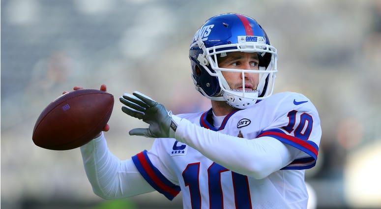 New York Giants quarterback Eli Manning (10) warms up before a game against the Dallas Cowboys at MetLife Stadium. NFL: Dallas Cowboys at New York Giants