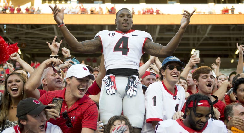 Georgia wide receiver Mecole Hardman (4) celebrates with fans after defeating Tennessee during the college football game at Neyland Stadium. NCAA Football: Georgia at Tennessee