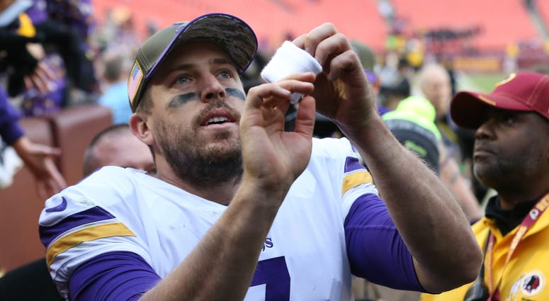 Minnesota Vikings quarterback Case Keenum (7) tosses his wristband into the stands while leaving the field after the Vikings' game against the Washington Redskins at FedEx Field. The Vikings won 38-30. NFL: Minnesota Vikings at Washington Redskins