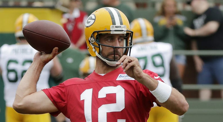 Green Bay Packers quarterback Aaron Rodgers (12) throws during training camp practice at Ray Nitschke Field. NFL: Green Bay Packers-Training Camp