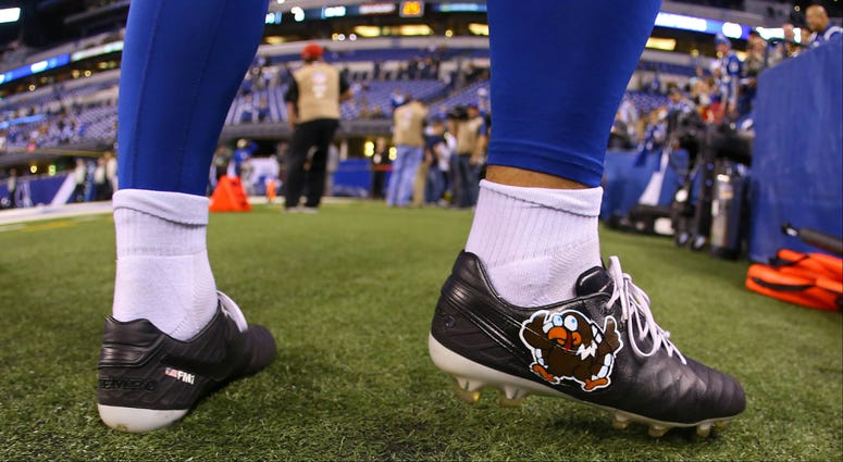 A view of the Thanksgiving themed cleats worn by Indianapolis Colts punter Pat McAfee (1) during warmups prior to the game against the Pittsburgh Steelers at Lucas Oil Stadium. NFL: Pittsburgh Steelers at Indianapolis Colts