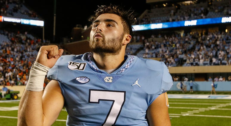 North Carolina Tar Heels quarterback Sam Howell (7) celebrates after leading the North Carolina Tar Heels to a 28-25 win over the Miami Hurricanes at Kenan Memorial Stadium. North Carolina Tar Heels quarterback Sam Howell (7) celebrates after leading the North Carolina Tar Heels to a 28-25 win over the Miami Hurricanes at Kenan Memorial Stadium.