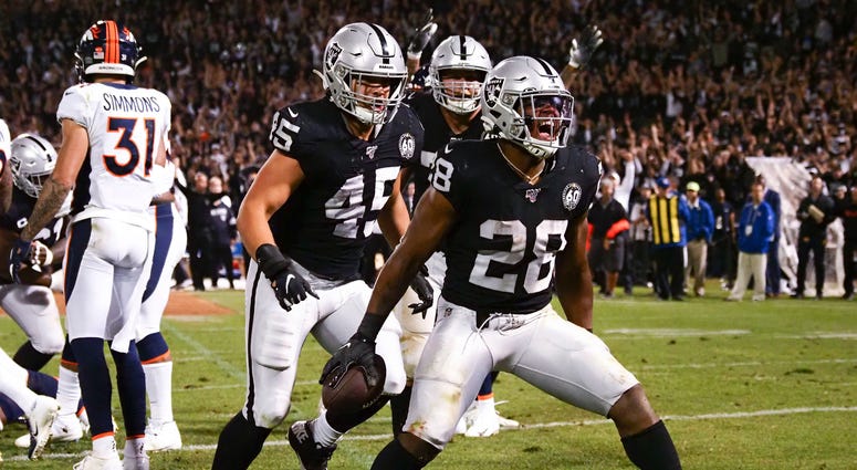 Oakland Raiders running back Josh Jacobs (28) celebrates after scoring a touchdown against the Denver Broncos during the fourth quarter at Oakland Coliseum Oakland Raiders running back Josh Jacobs (28) celebrates after scoring a touchdown against the Denver Broncos during the fourth quarter at Oakland Coliseum