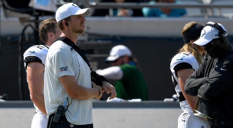acksonville Jaguars quarterback Nick Foles (7) looks on from the sidelines in a sling during the fourth quarter against the Kansas City Chiefs acksonville Jaguars quarterback Nick Foles (7) looks on from the sidelines in a sling during the fourth quarter against the Kansas City Chiefs