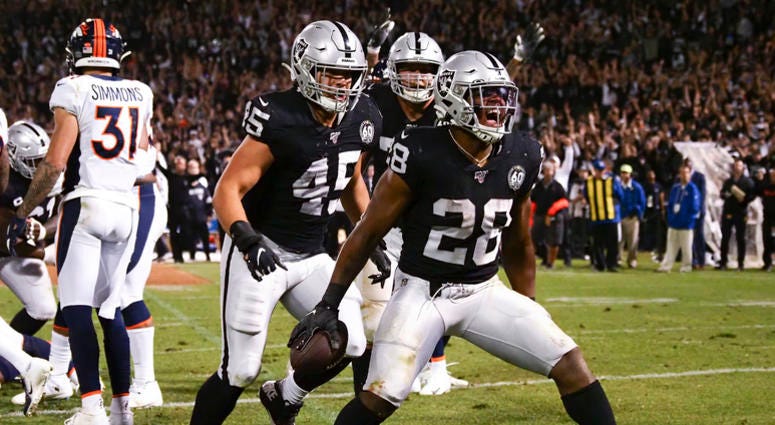 Oakland Raiders running back Josh Jacobs (28) celebrates after scoring a touchdown against the Denver Broncos during the fourth quarter at Oakland Coliseum Oakland Raiders running back Josh Jacobs (28) celebrates after scoring a touchdown against the Denver Broncos during the fourth quarter at Oakland Coliseum