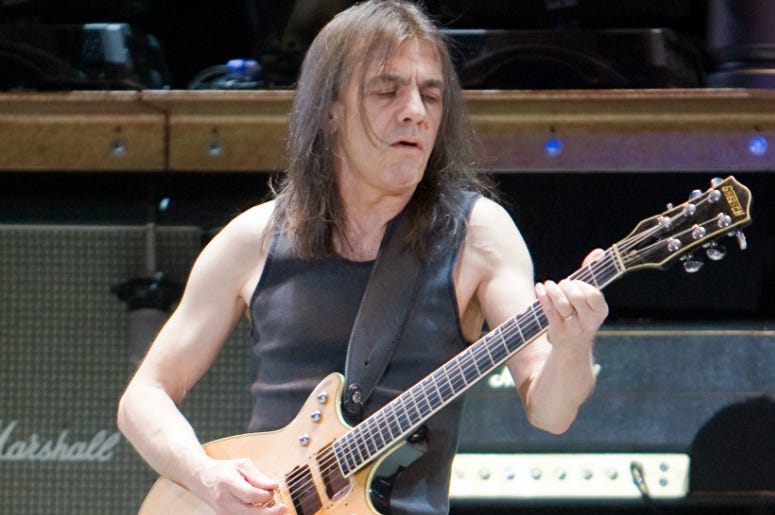 Rhythm guitarist Malcolm Young of AC/DC plays in front of 45,000 plus screaming fans at the Rogers Centre as part of their 2008/09 Black Ice World Tour. Rhythm guitarist Malcolm Young of AC/DC plays in front of 45,000 plus screaming fans at the Rogers Centre as part of their 2008/09 Black Ice World Tour.