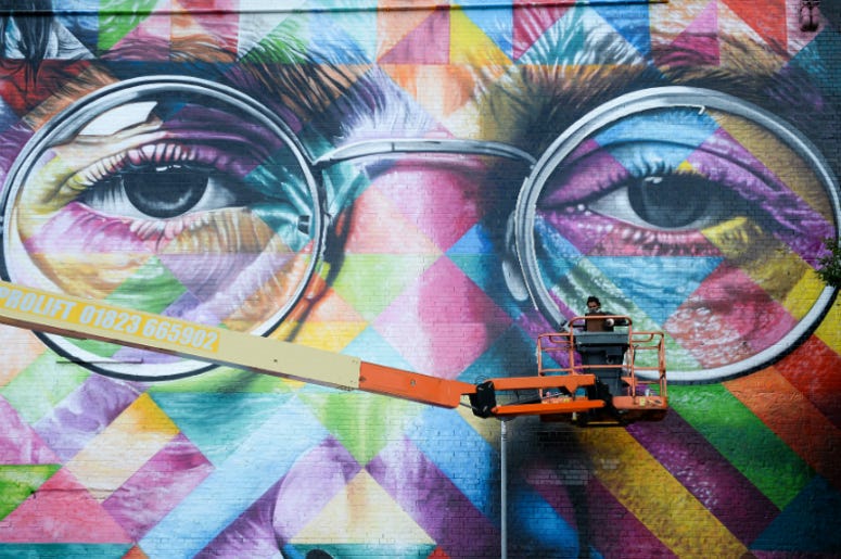 John Lennon mural in Bristol 1/1/2018 - Review of the Year 2017: July: A graffiti artist works on a huge mural of John Lennon as he takes part in Upfest, a street art and graffiti festival in Bristol.