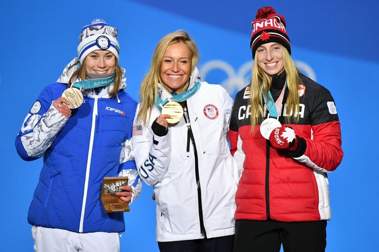 USA's Jamie Anderson Gets the GOLD! Feb 12, 2018; Pyeongchang, South Korea; Silver medalist Laurie Blouin (CAN), left, poses for a photo with gold medalist Jamie Anderson (USA), center, and bronze medalist Ennie Rukajarvi (FIN) during the medals ceremony for the ladies slope side snowboard