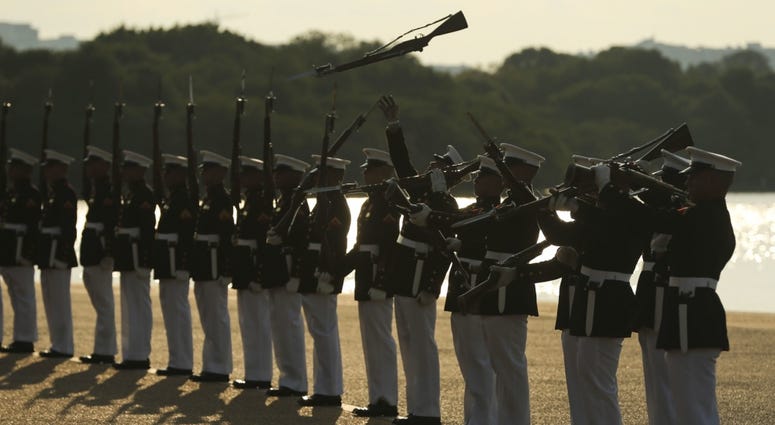 Marines with the U.S. Marine Corps Silent Drill Platoon execute their “long line” sequence during a Tuesday Sunset Parade at the Jefferson Memorial, Washington, D.C., July 9, 2019 Marines with the U.S. Marine Corps Silent Drill Platoon execute their “long line” sequence.