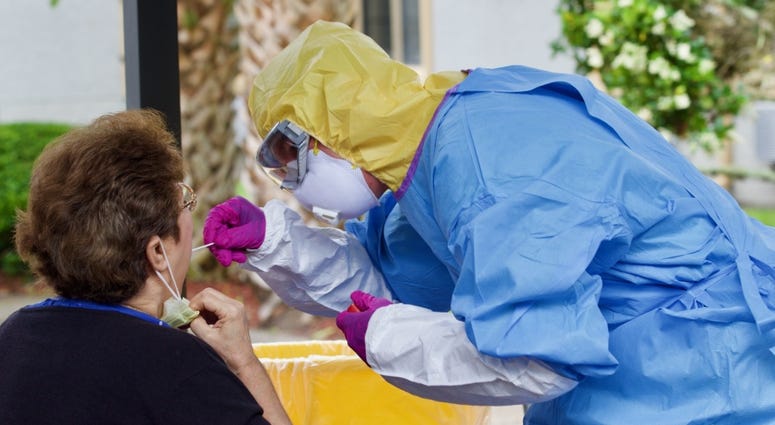 Florida National Guard Spc. Andrew Honecker, with the 868th Engineer Company, conducts a coronavirus test as part of Northeast Florida’s COVID-19 mobile team, April 20, 2020. Coronavirus