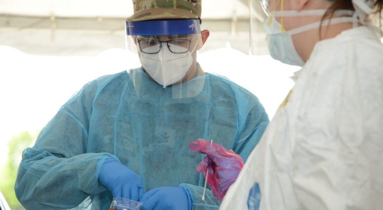 U.S. Air National Guard Senior Airman Manuel Zertuche 185th Air Refueling Wing medical technician works with medical staff in order to administer a COVID-19 test at the Sioux Center, Iowa “TestIowa” test site on May 27, 2020. U.S. Air National Guard Senior Airman Manuel Zertuche 185th Air Refueling Wing medical technician works with medical staff in order to administer a COVID-19 test at the Sioux Center, Iowa “TestIowa” test site on May 27, 2020.