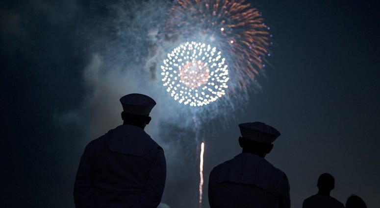 Sailors enjoy fireworks during the 42nd annual Yokosuka Friendship Day celebration onboard U.S. Fleet Activities (FLEACT) Yokosuka. Fireworks