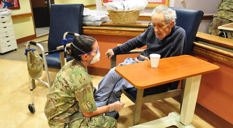 U.S. Army Spc. Laurel Yerg, a Combat Medic with the 1st Battalion, 114th Infantry Regiment, New Jersey Army National Guard (NJARNG), checks on a resident of the New Jersey Veterans Memorial Home at Menlo Park in Edison, N.J., April 17, 2020. U.S. Army Spc. Laurel Yerg, a Combat Medic with the 1st Battalion, 114th Infantry Regiment, New Jersey Army National Guard (NJARNG), checks on a resident of the New Jersey Veterans Memorial Home at Menlo Park in Edison, N.J., April 17, 2020.
