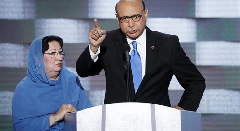 In this July 28, 2016, file photo, Khizr Khan, father of fallen US Army Capt. Humayun SM Khan, accompanied by his wife Ghazala at the Democratic National Convention in Philadelphia.