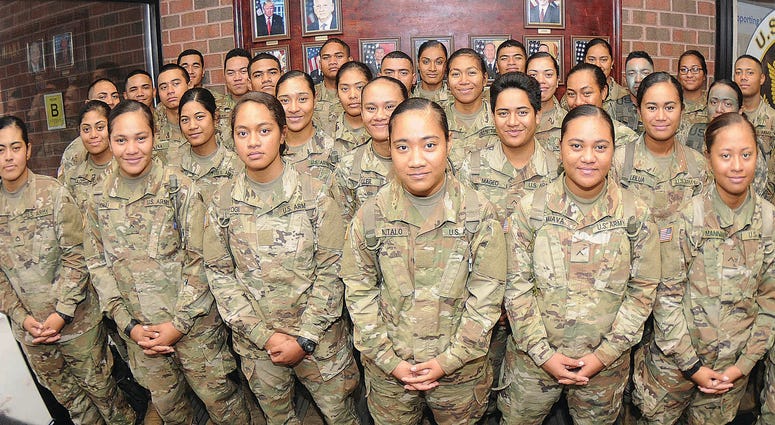 More than 30 members of an American Samoa family pose for pictures at Thompson Hall, Fort Lee, Va.