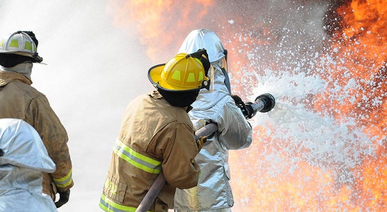 U.S. Air Force and New Jersey state fire protection specialists from the New Jersey Air National Guard's 177th Fighter Wing battle a simulated aircraft fire with Aqueous Film Forming Foam at Military Sealift Command Training Center East in Freehold, N.J. 177thFighterWingNJAirNationalGuard