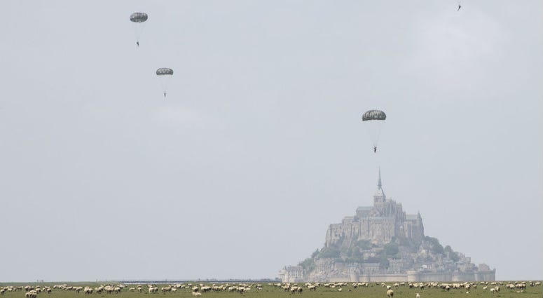 U.S Army Special Forces commemorate WWII with jump into Mont Saint-Michel, Normandy, France. U.S Army Special Forces commemorate WWII with jump into Mont Saint-Michel, Normandy, France.
