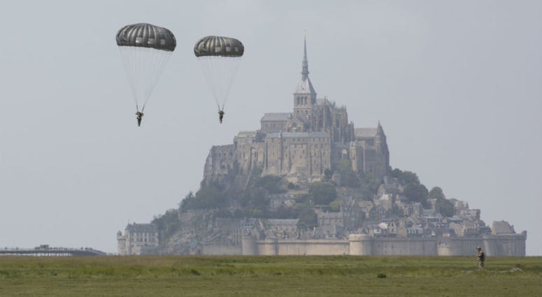 U.S Army Special Forces commemorate WWII with jump into Mont Saint-Michel, Normandy, France. U.S Army Special Forces commemorate WWII with jump into Mont Saint-Michel, Normandy, France.