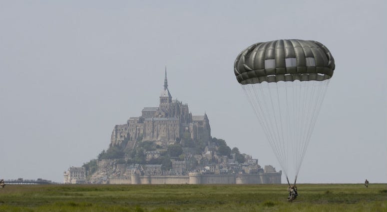 U.S Army Special Forces commemorate WWII with jump into Mont Saint-Michel, Normandy, France. U.S Army Special Forces commemorate WWII with jump into Mont Saint-Michel, Normandy, France.