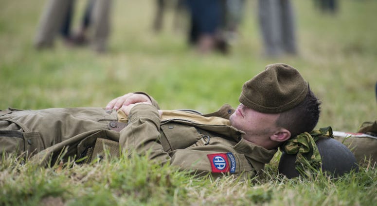 Louis Boyer, parachutist, takes a little cat-nap after jumping from a C-47 Skytrain. Over 1,000 U.S. paratroopers participate in largest airborne operation since WWII to commemorate 75th anniversary of D-Day.