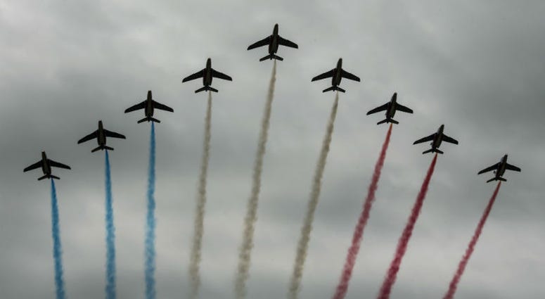 French Air Force aerial demonstration team, conducts a flight over Iron Mike Drop Zone, outside of Saint-Mere-Eglise. Over 1,000 U.S. paratroopers participate in largest airborne operation since WWII to commemorate 75th anniversary of D-Day.