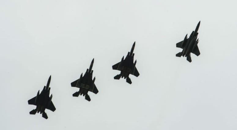 Four F-15E Strikes Eagles, assigned to the 48th Fighter Squadron, Royal Air Force Lakenheath, England,conduct a fighter escort for 23 aircraft dropping personnel. Over 1,000 U.S. paratroopers participate in largest airborne operation since WWII to commemorate 75th anniversary of D-Day.