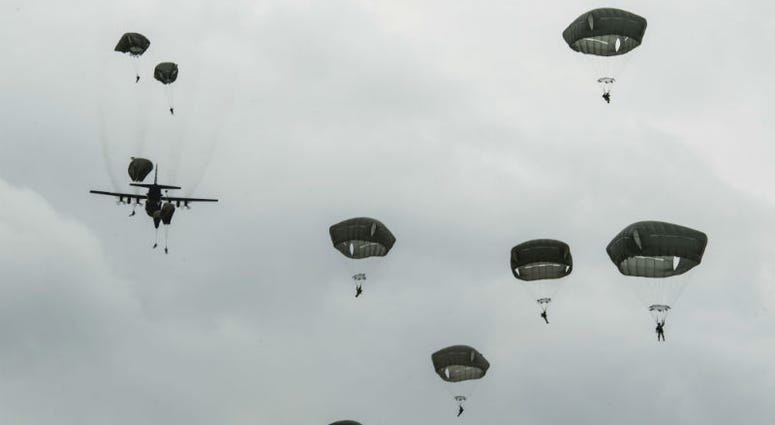 International Patatroopers participating in the D-Day Commemoration Airborne Operation fall into Iron Mike Drop Zone outside of Saint-Mere-Eglise, France. Over 1,000 U.S. paratroopers participate in largest airborne operation since WWII to commemorate 75th anniversary of D-Day.