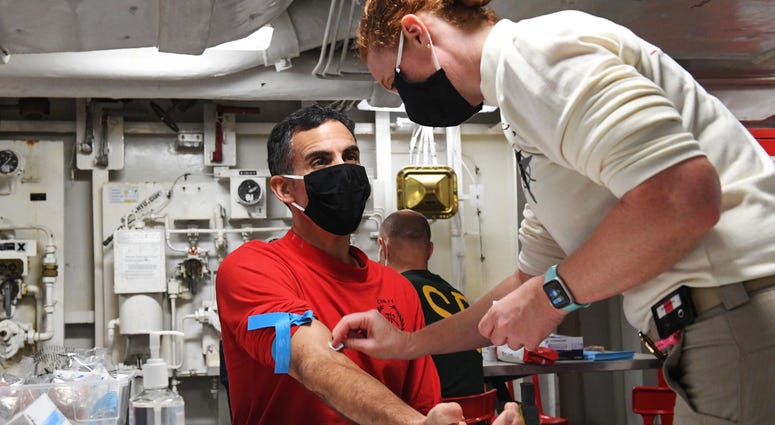 Navy Capt. Carlos Sardiello, commanding officer of the aircraft carrier USS Theodore Roosevelt