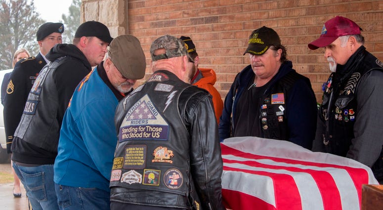 Veterans with coffin