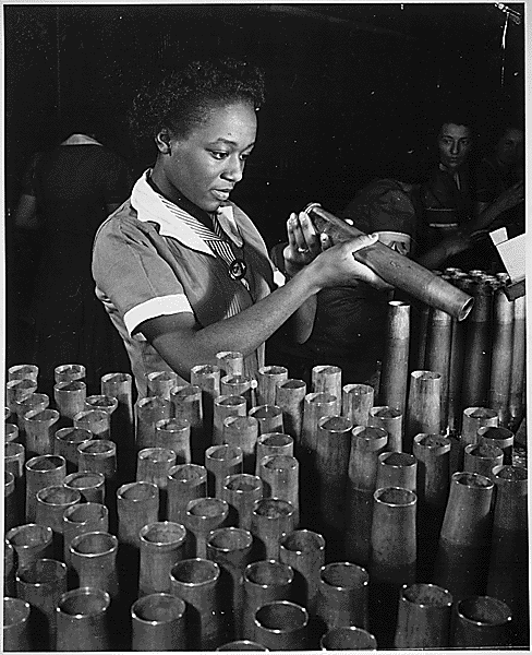 Bertha Stallworth, age 21, shown inspecting end of 40mm artillery cartridge case at Frankford Arsenal. RosietheRiveter