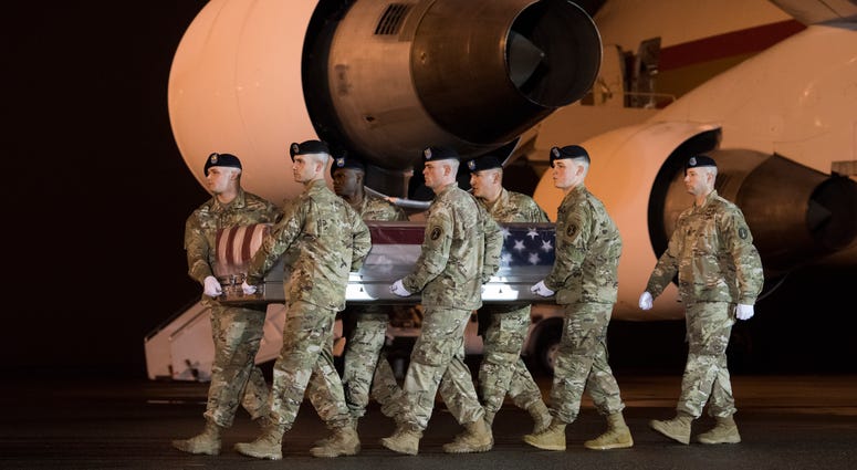 A U.S. Army carry team transfers the remains of Army Maj. Brent Taylor of Ogden, Utah, Nov. 6, 2018