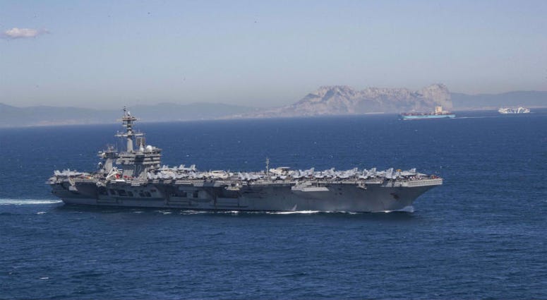 USS Abraham Lincoln sails in the Mediterranean Sea. U.S. deploys aircraft carrier after credible intelligence that Iranian forces were targeting American forces.