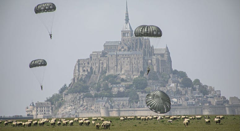 U.S Army Special Forces commemorate WWII with jump into Mont Saint-Michel, Normandy, France. U.S Army Special Forces commemorate WWII with jump into Mont Saint-Michel, Normandy, France.