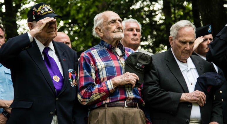 WWII veterans pay respect to the U.S. flag at the 30th ID Old Hickory memorial ceremony on June 2 at Mortain, France. WWII veterans pay respect to the U.S. flag at the 30th ID Old Hickory memorial ceremony on June 2 at Mortain, France.