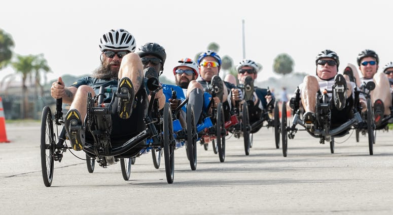 U.S. Navy veteran Chief Petty Officer Joshua Erickson, Team Navy, leads competitors during the 2019 DoD Warrior Games cycling road race U.S. Navy veteran Chief Petty Officer Joshua Erickson, Team Navy, leads competitors during the 2019 DoD Warrior Games cycling road race