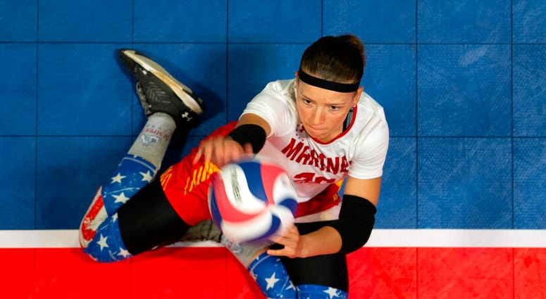 Marine Cpl. Tisha Knickerbocker serves during a preliminary volleyball match Marine Cpl. Tisha Knickerbocker serves during a preliminary volleyball match