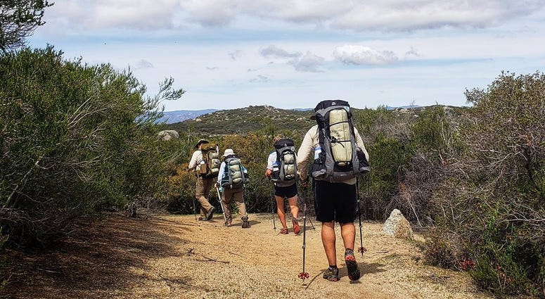 Warrior Expedition veterans make their way across the mountains from Camp, CA Walking off the war with Warrior Expeditions